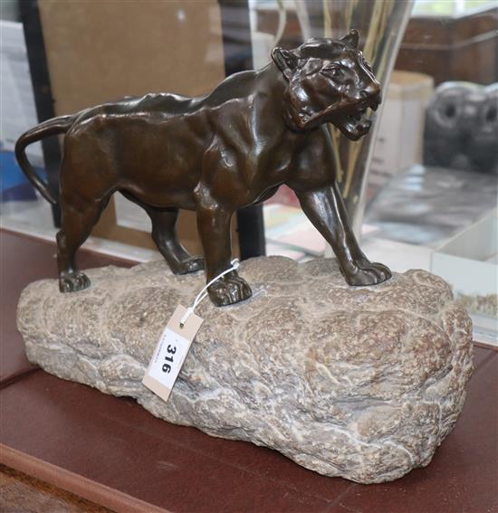 A bronze tiger, on stone base